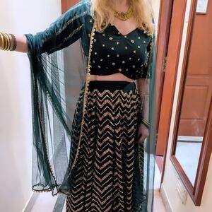 Deep green lehenga set with blouse and dupatta
